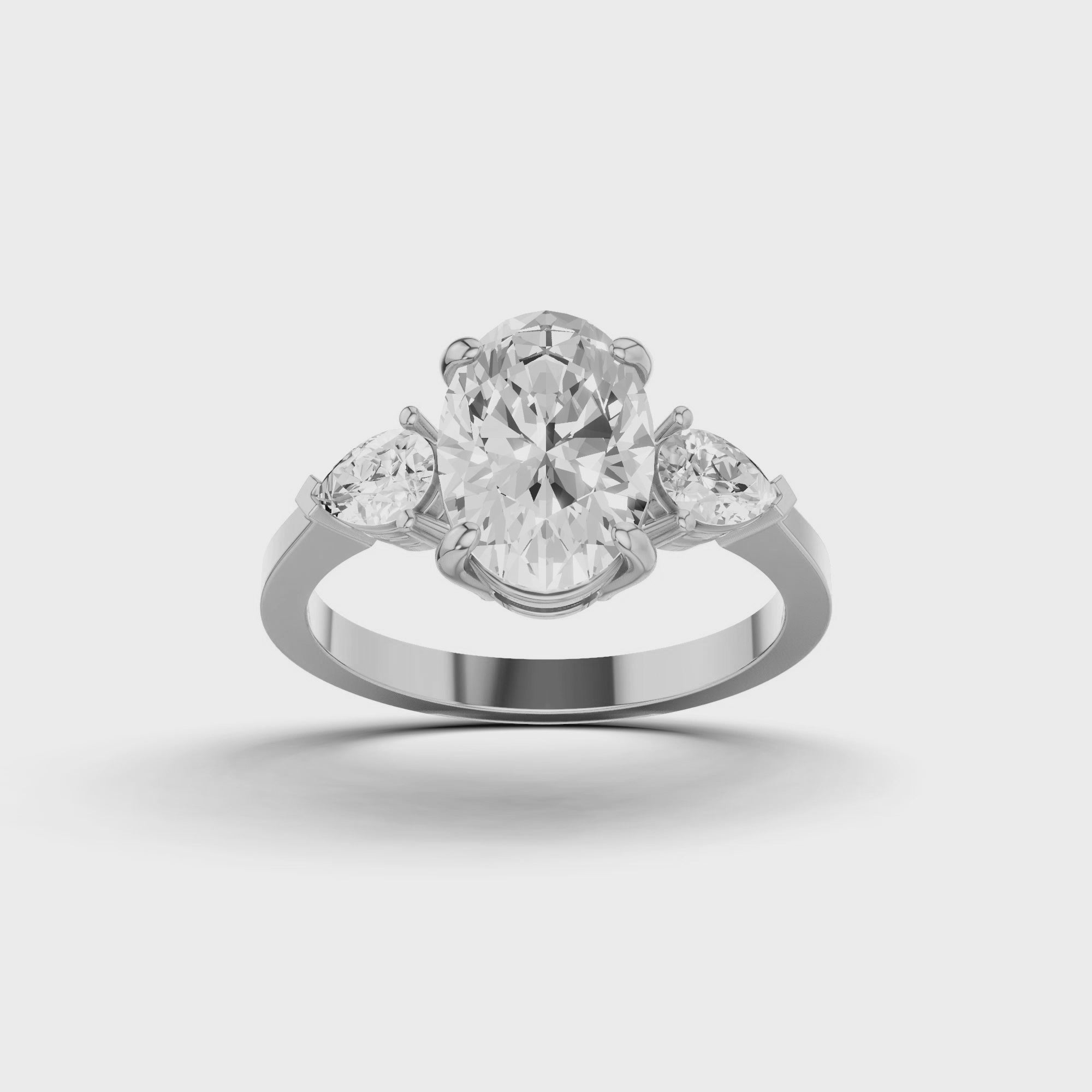 Oval & Pear Three Stone Ring
